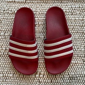 Red adidas rubber slides